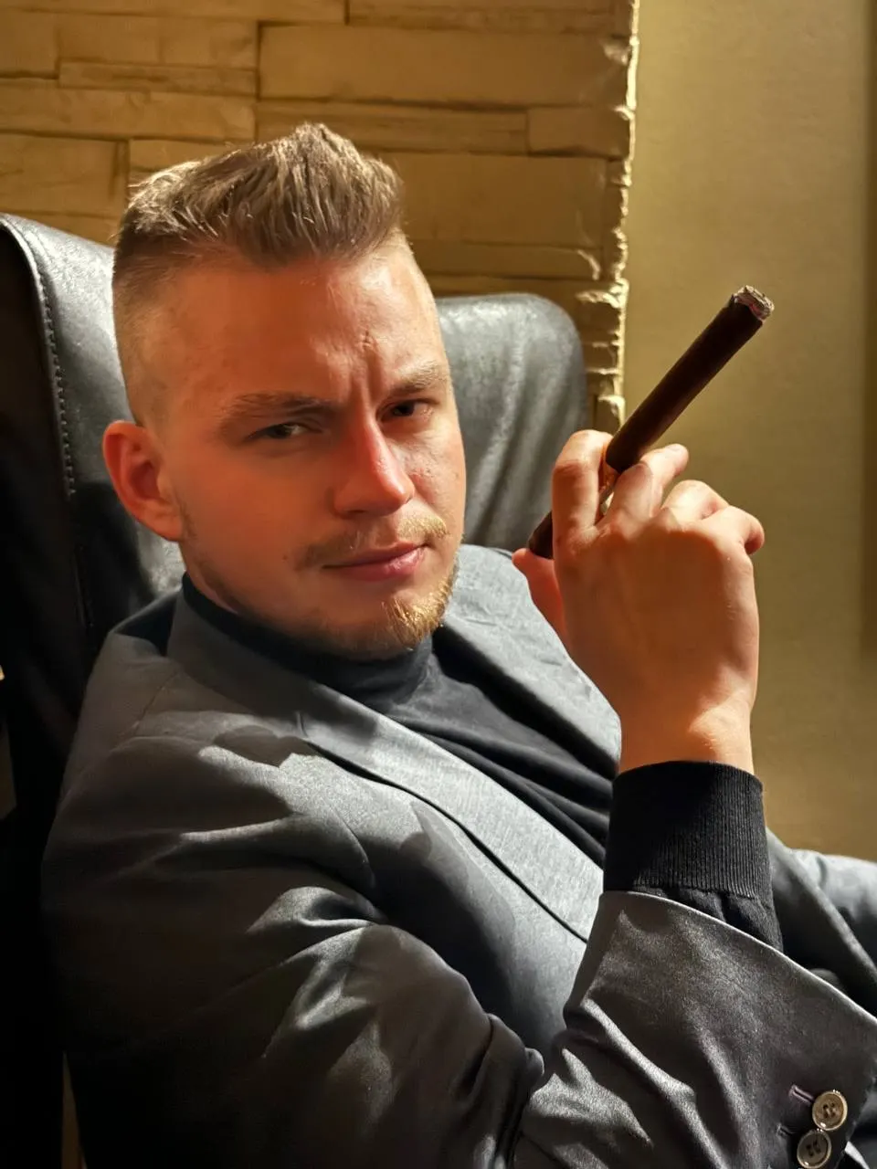 Anatolie with a cigar in a lounge chair